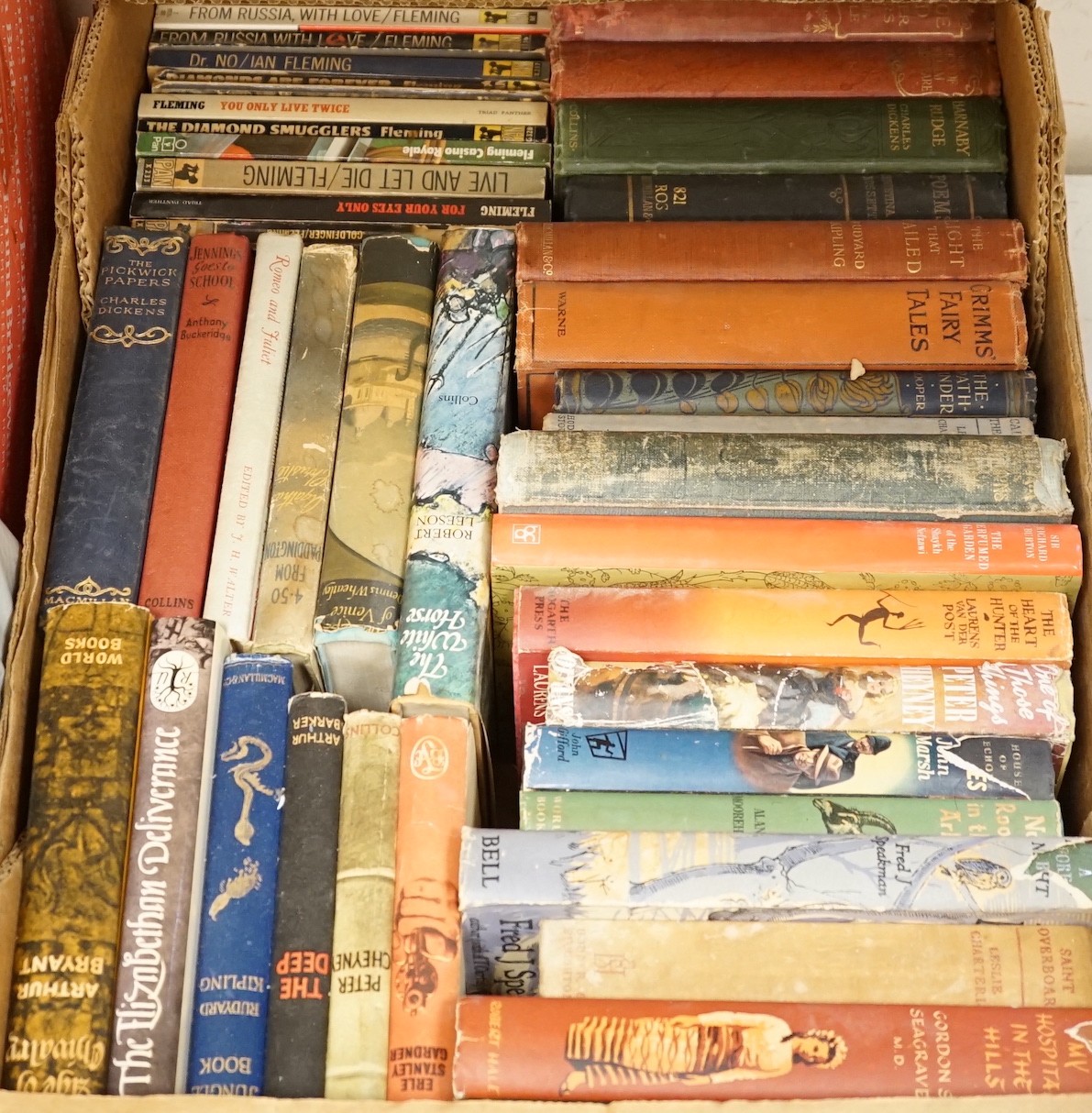 A large quantity of various books to include Ian Fleming, Charles Dickens, encyclopedias, Punch etc.